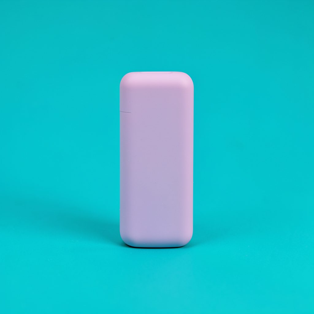 A red disposable vape device shown on a clean white seamless background in a tidy product photograph.
